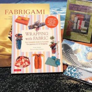 Paper isn’t the only thing we carry. We have a few Furoshiki in stock which make a great reusable gift wrap alternative! We also have books on wrapping, wrapping with fabric, as well as using fabric to create origami! How cool is that? “The Japanese Art of Gift Wrapping” dvd, by our very own Vicky Mihara Avery, is available in store only but you can shop the other books online!