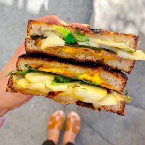 This is our famous grilled cheese sandwich with cheddar and gouda🧀, marinated apples🍏, and bacon🥓 on multigrain miche. Such a great combo!