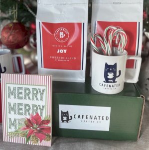 Holiday Gift Idea from Cafenated Coffee on Vine Street!

We are excited to have our Christmas gift box special. For a limited time only, we will have a Cafenated Mug and your choice of two single-origin coffee bags for only $25.