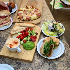 Hummus plate made vegan by substituting avocado for cheese, our famous Beetloaf Sandwich, ham & pineapple pizza, trout bagel, side salad. Yummy goodness!

Extended hours are coming soon!!! And we’ll be beginning our live music and Wine Patio again, plus comedy Saturdays 2-4 pm every week.