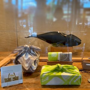 If you’ve taken a basket class with us recently, it’s been with Akemi S, a senior instructor at GrayMist. She frequently changes our table display with merchandise and fresh flowers, and this week she is highlighting our furoshiki gift wrap and several GrayMist Original products from Japan.
